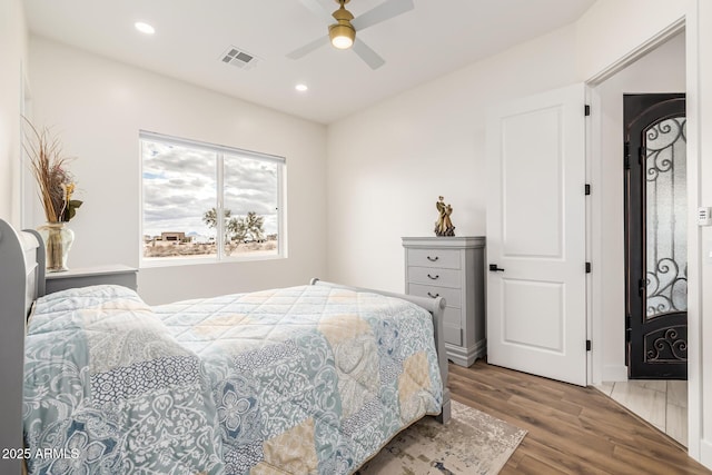 bedroom featuring recessed lighting, visible vents, wood finished floors, and a ceiling fan