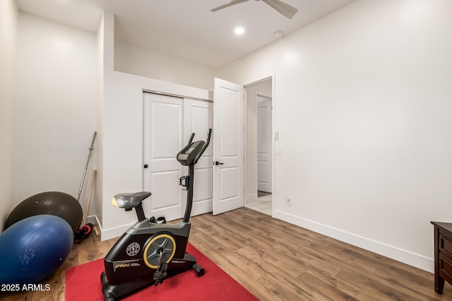 workout area featuring ceiling fan, baseboards, wood finished floors, and recessed lighting