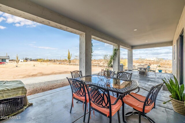 view of patio / terrace with a grill and outdoor dining area