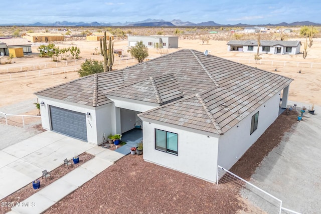 bird's eye view featuring a mountain view and view of desert