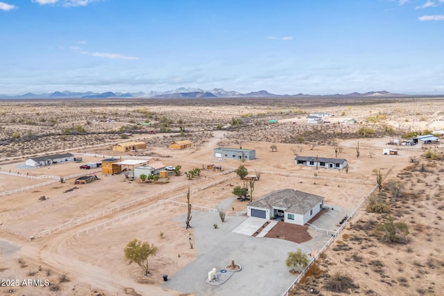 bird's eye view featuring a mountain view, a rural view, and a desert view