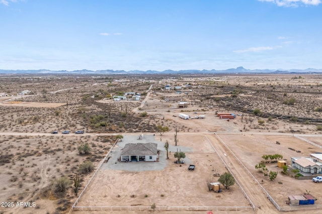 birds eye view of property with a mountain view and a desert view