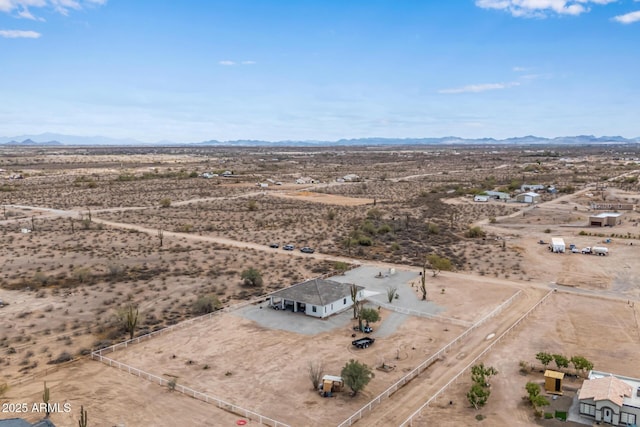 aerial view featuring a mountain view, a rural view, and a desert view