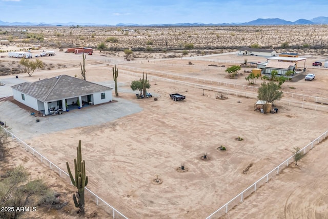 bird's eye view featuring a mountain view, a rural view, and a desert view