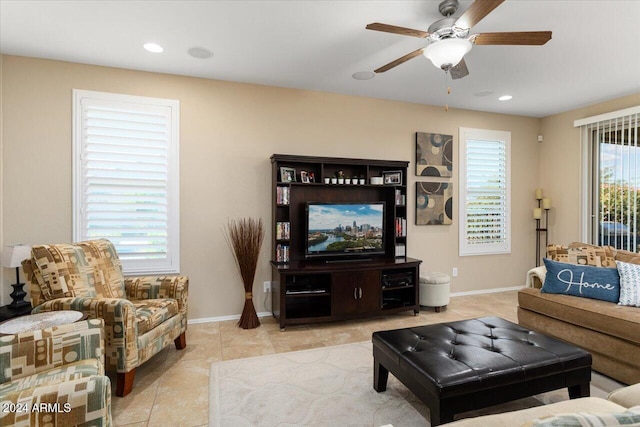 living room with light tile patterned floors and ceiling fan