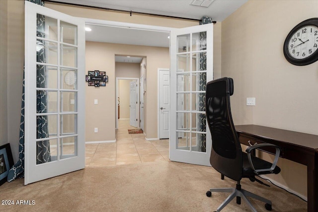 carpeted office featuring french doors