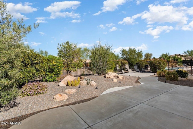 exterior space featuring a swimming pool and a patio area