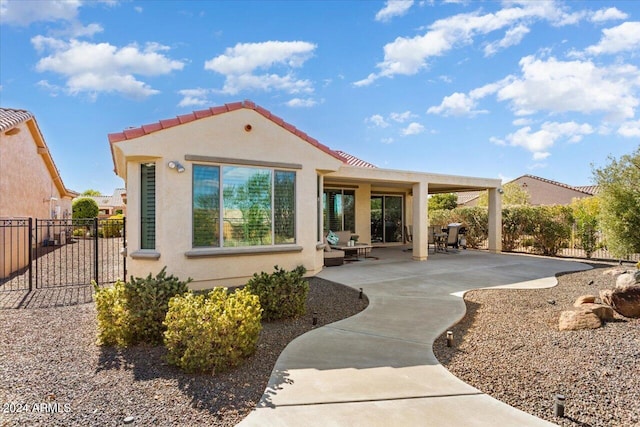 back of property with a patio area