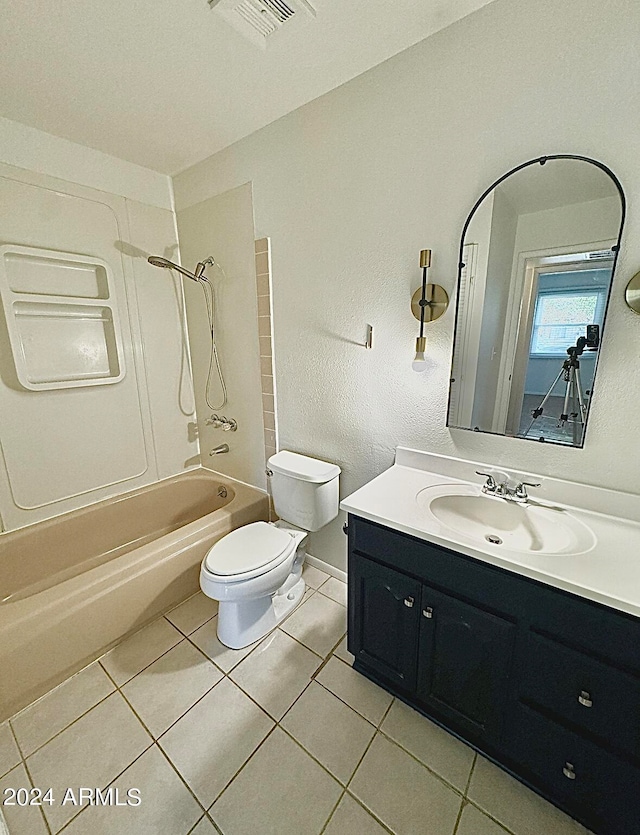 full bathroom with bathtub / shower combination, vanity, tile patterned flooring, and toilet