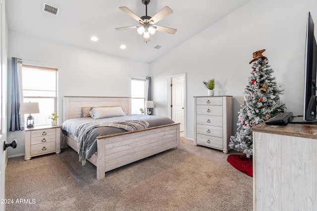 carpeted bedroom with ceiling fan and lofted ceiling