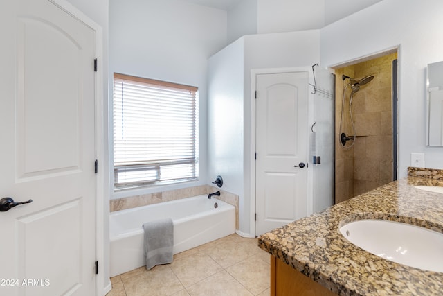 bathroom with tile patterned floors, vanity, and plus walk in shower