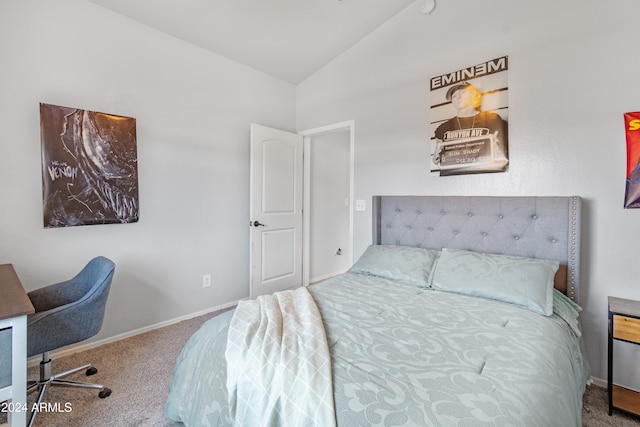 carpeted bedroom featuring vaulted ceiling