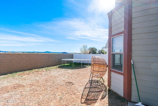 view of yard featuring a trampoline