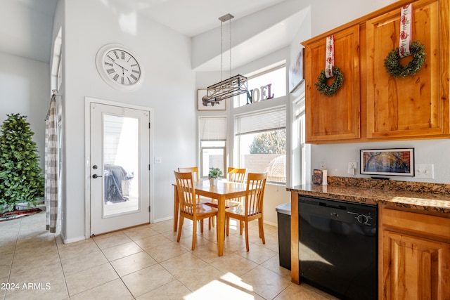 kitchen with dishwasher, light tile patterned floors, decorative light fixtures, and an inviting chandelier