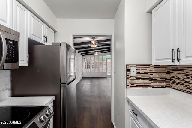 3046 N 32nd St Unit 328, Phoenix, AZ 85018 - kitchen featuring decorative backsplash, light stone countertops, wood finished floors, and stainless steel appliances
