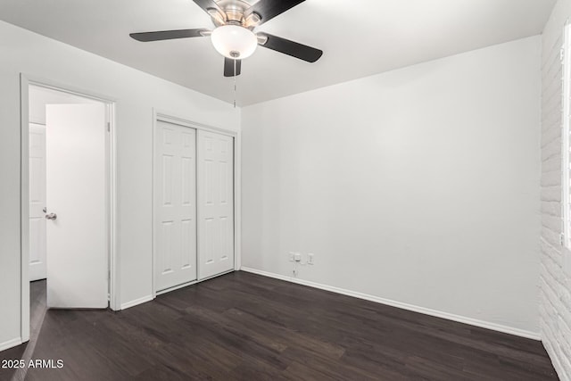 3046 N 32nd St Unit 328, Phoenix, AZ 85018 - unfurnished bedroom with ceiling fan, a closet, baseboards, and dark wood-style floors