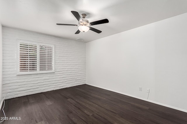 3046 N 32nd St Unit 328, Phoenix, AZ 85018 - unfurnished room featuring brick wall, baseboards, ceiling fan, and wood finished floors