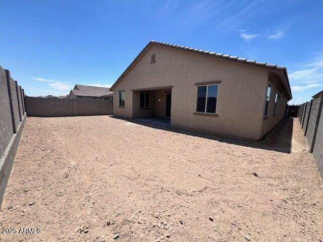2945 S 232nd Dr, Buckeye, AZ 85326 - back of property featuring stucco siding and a fenced backyard