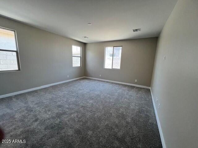 2945 S 232nd Dr, Buckeye, AZ 85326 - carpeted spare room featuring baseboards