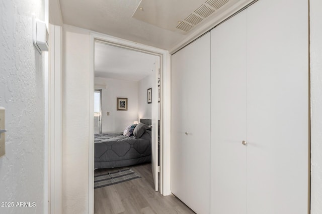 12123 W Bell Rd Unit 339, Surprise, AZ 85378 - hall featuring visible vents and light wood-style floors