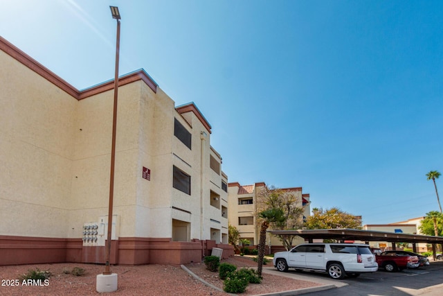 12123 W Bell Rd Unit 339, Surprise, AZ 85378 - view of property with covered parking