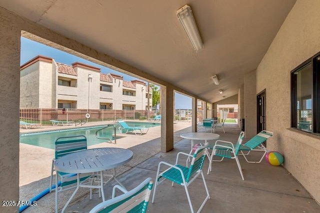 12123 W Bell Rd Unit 339, Surprise, AZ 85378 - view of patio featuring fence and a community pool