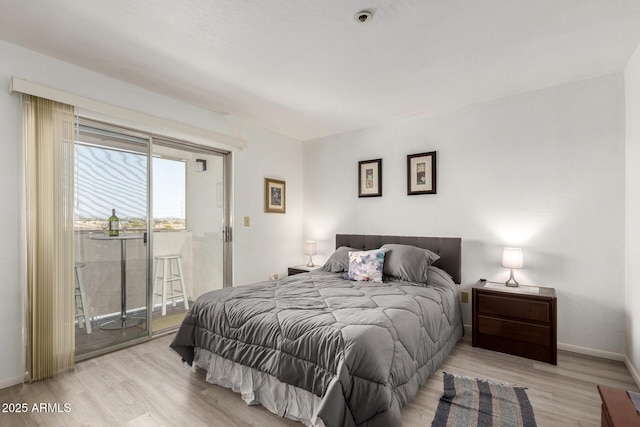 12123 W Bell Rd Unit 339, Surprise, AZ 85378 - bedroom with baseboards, wood finished floors, and access to outside