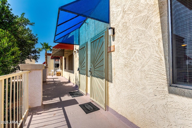 12123 W Bell Rd Unit 339, Surprise, AZ 85378 - view of home's exterior featuring stucco siding and a balcony
