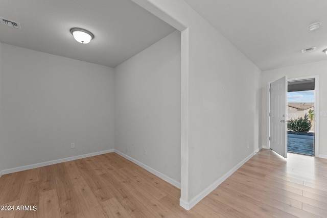 additional living space with light hardwood / wood-style floors