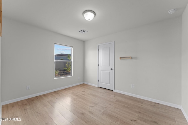 unfurnished room with light hardwood / wood-style flooring