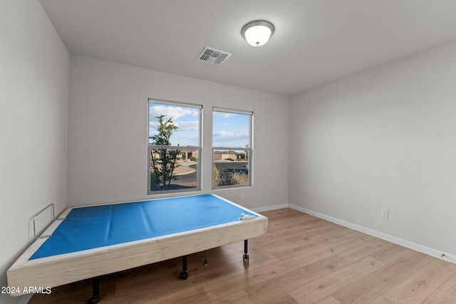 recreation room featuring light hardwood / wood-style flooring