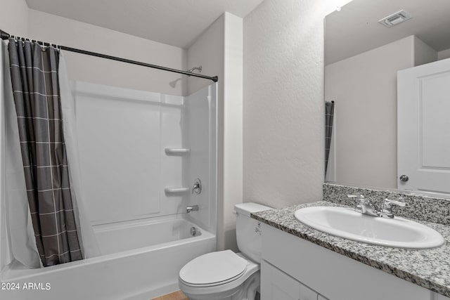 full bathroom featuring shower / tub combo, vanity, and toilet