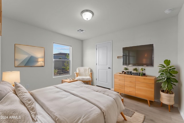 bedroom with light wood-type flooring