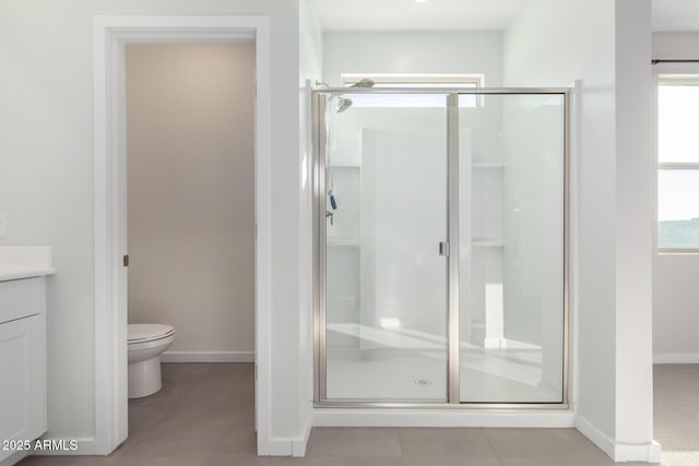 1523 S 223rd Dr, Buckeye, AZ 85326 - bathroom with a stall shower, toilet, vanity, baseboards, and tile patterned floors
