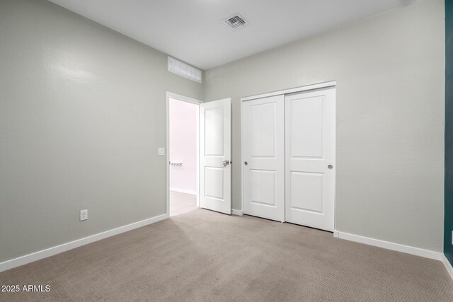 1523 S 223rd Dr, Buckeye, AZ 85326 - unfurnished bedroom with light carpet, a closet, and baseboards