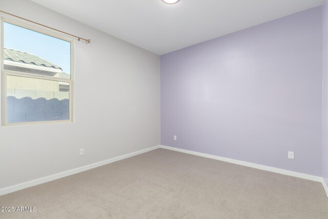 1523 S 223rd Dr, Buckeye, AZ 85326 - spare room with light colored carpet and baseboards