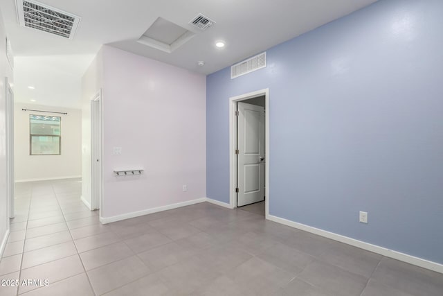 1523 S 223rd Dr, Buckeye, AZ 85326 - tiled spare room featuring attic access, recessed lighting, and baseboards