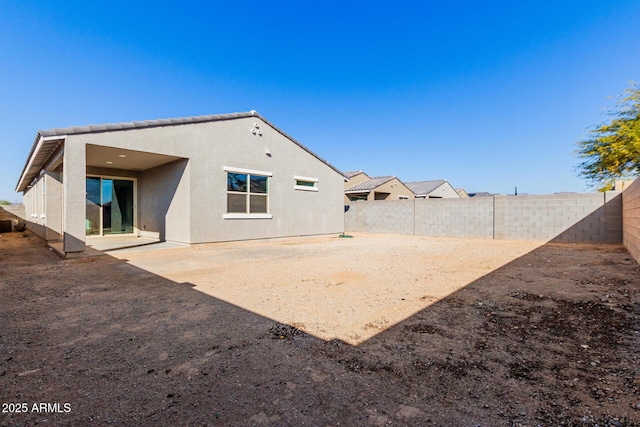 1523 S 223rd Dr, Buckeye, AZ 85326 - back of house featuring stucco siding, a fenced backyard, and a patio