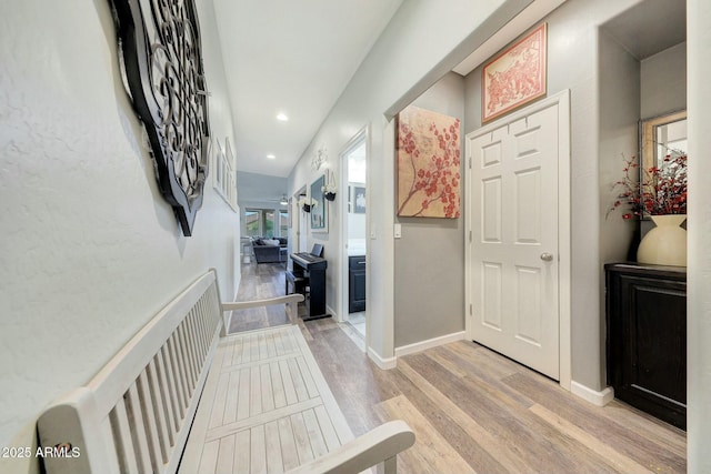 hall with light hardwood / wood-style floors