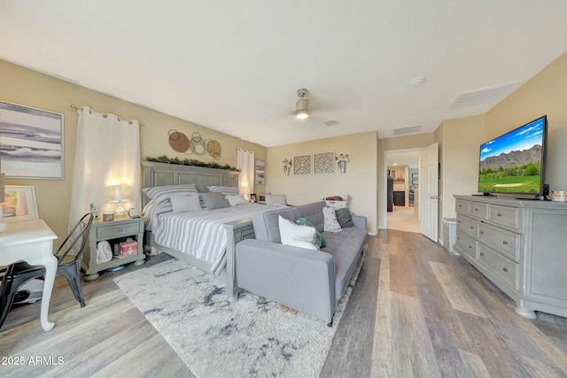 bedroom featuring ceiling fan and light hardwood / wood-style floors