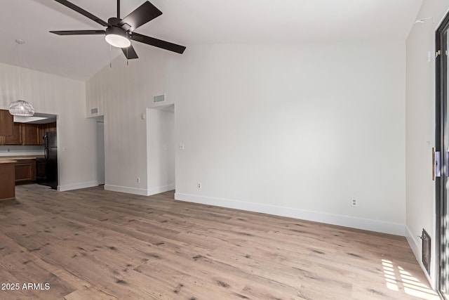 2455 E Broadway Rd Unit 39, Mesa, AZ 85204 - unfurnished living room with light wood finished floors, baseboards, a ceiling fan, and visible vents