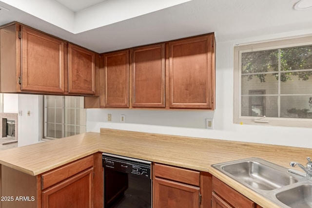 2455 E Broadway Rd Unit 39, Mesa, AZ 85204 - kitchen with a sink, brown cabinets, dishwasher, light countertops, and a peninsula