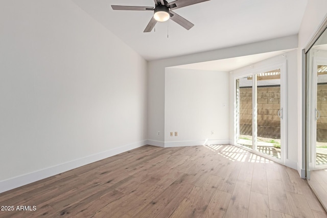 2455 E Broadway Rd Unit 39, Mesa, AZ 85204 - empty room featuring light wood finished floors, vaulted ceiling, a ceiling fan, and baseboards