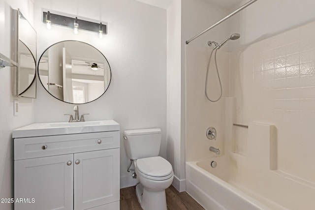 2455 E Broadway Rd Unit 39, Mesa, AZ 85204 - full bath with toilet, baseboards, wood finished floors, washtub / shower combination, and vanity