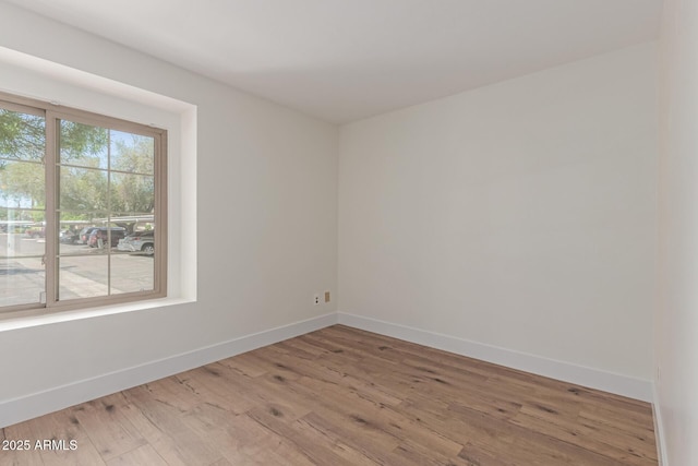 2455 E Broadway Rd Unit 39, Mesa, AZ 85204 - unfurnished room featuring light wood-type flooring and baseboards