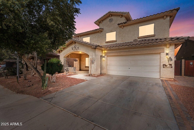 mediterranean / spanish-style house featuring a garage