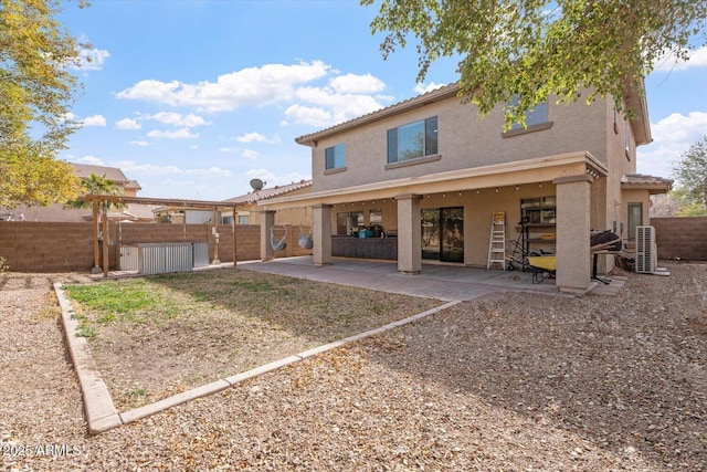 back of property featuring a patio