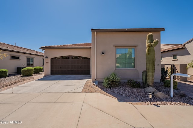 35756 N Clementine Trl, San Tan Valley, AZ 85140 - mediterranean / spanish home featuring stucco siding, an attached garage, central AC unit, and concrete driveway