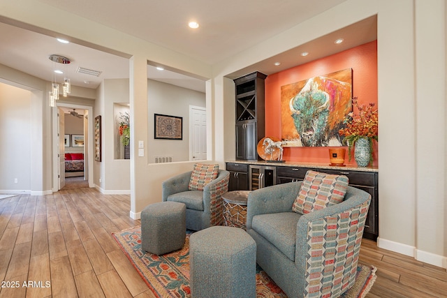 35756 N Clementine Trl, San Tan Valley, AZ 85140 - living room featuring wine cooler, baseboards, recessed lighting, and light wood-style flooring