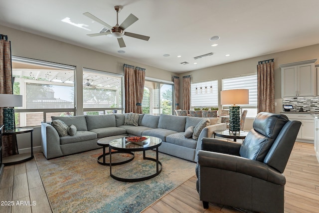 35756 N Clementine Trl, San Tan Valley, AZ 85140 - living room featuring light wood finished floors, visible vents, recessed lighting, and ceiling fan